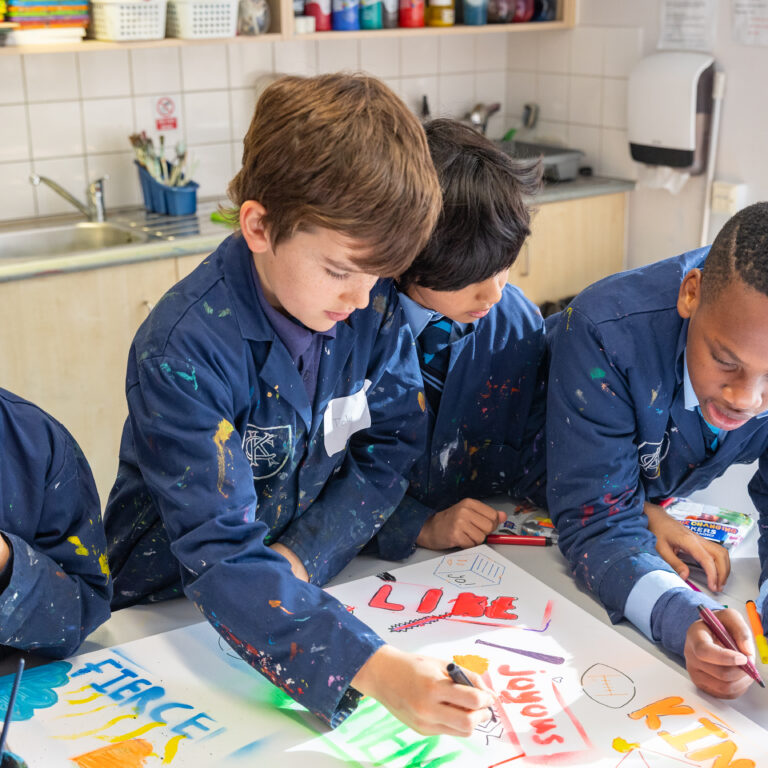 students drawing on paper